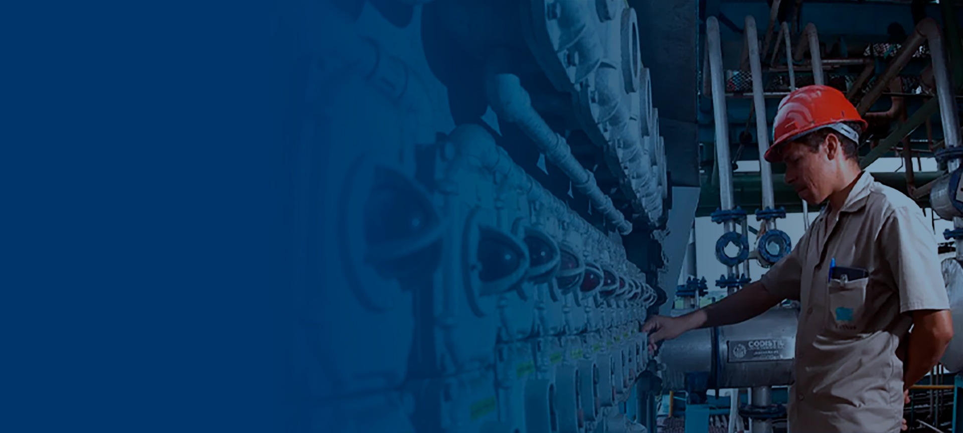 an abstract photo of a curved building with a blue sky in the background