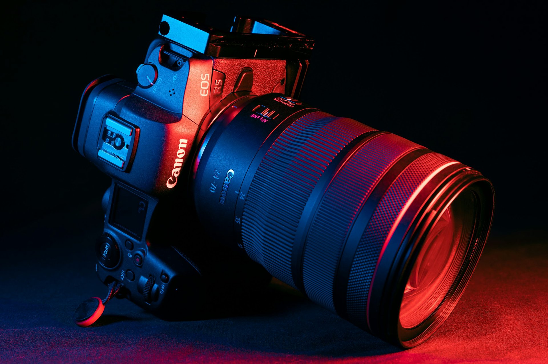 black nikon dslr camera on blue surface