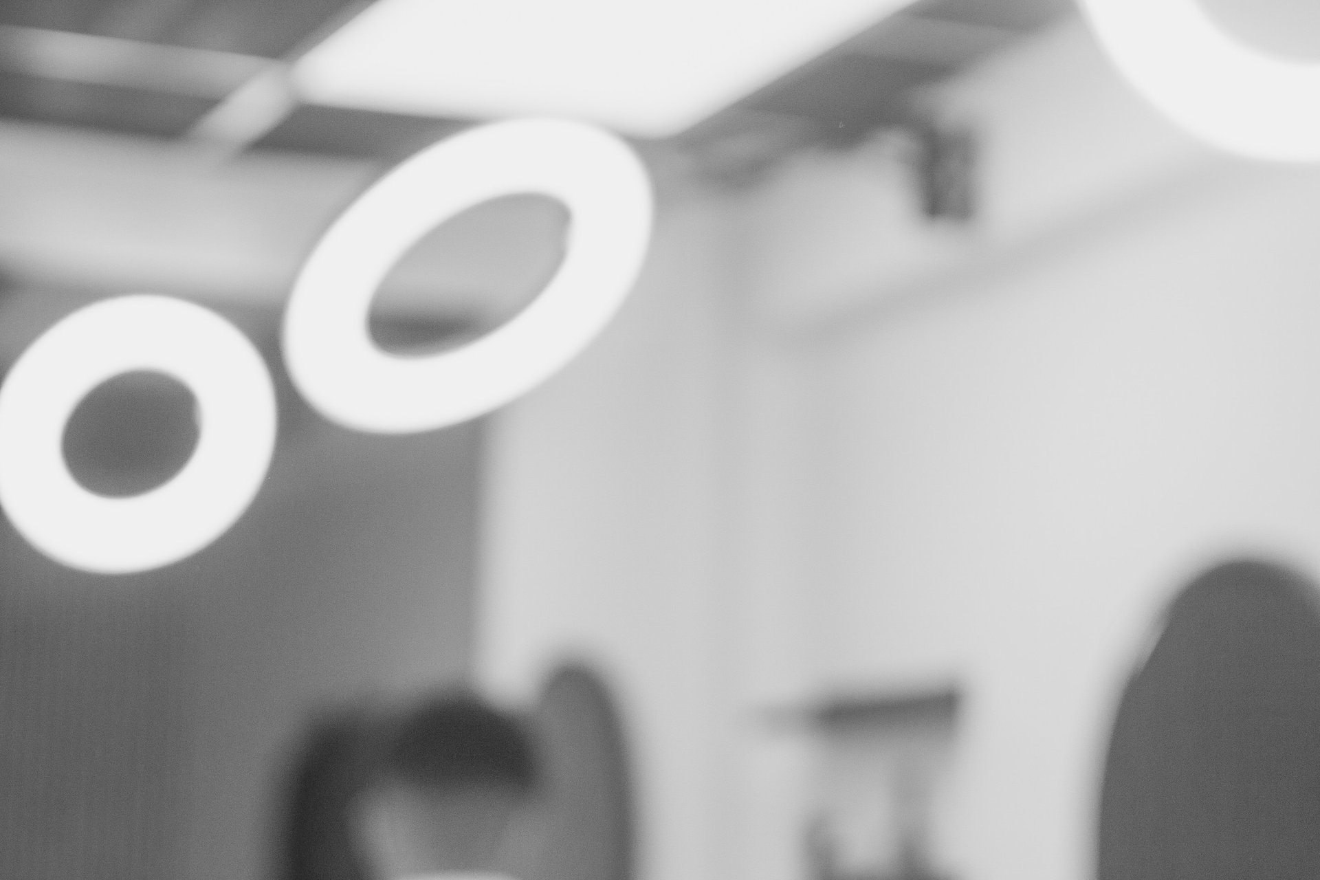 Blurred lights, mirrors, and the background of a barbershop