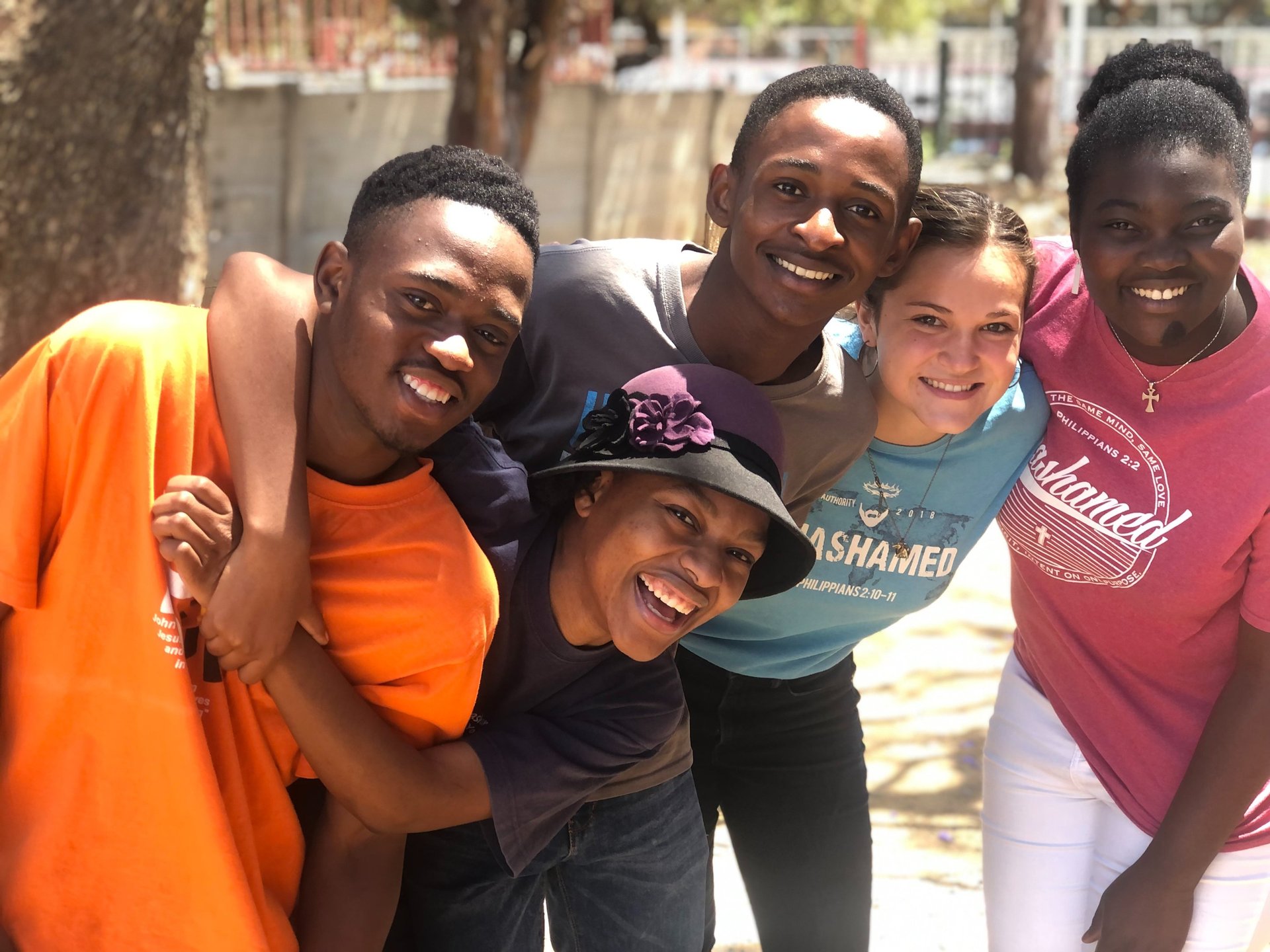 woman wearing yellow long-sleeved dress under white clouds and blue sky during daytime