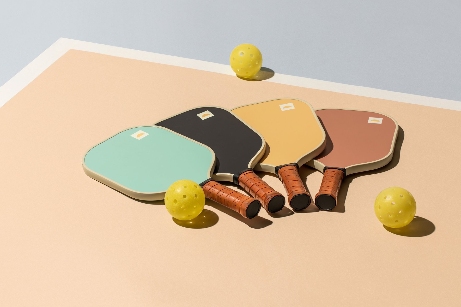 A tennis racket and ball on a tennis court