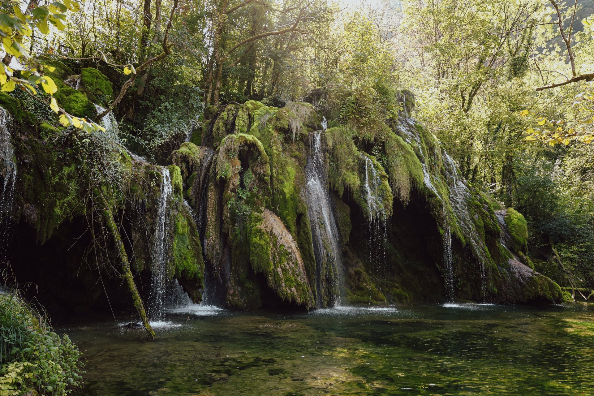 an abstract photo of a curved building with a blue sky in the background