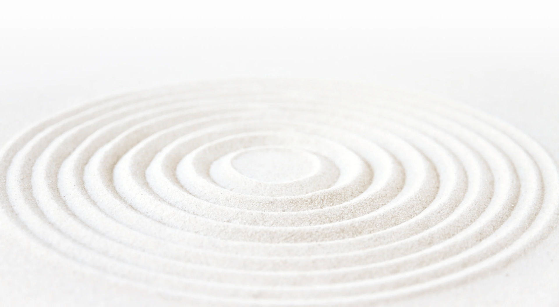 an abstract photo of a curved building with a blue sky in the background