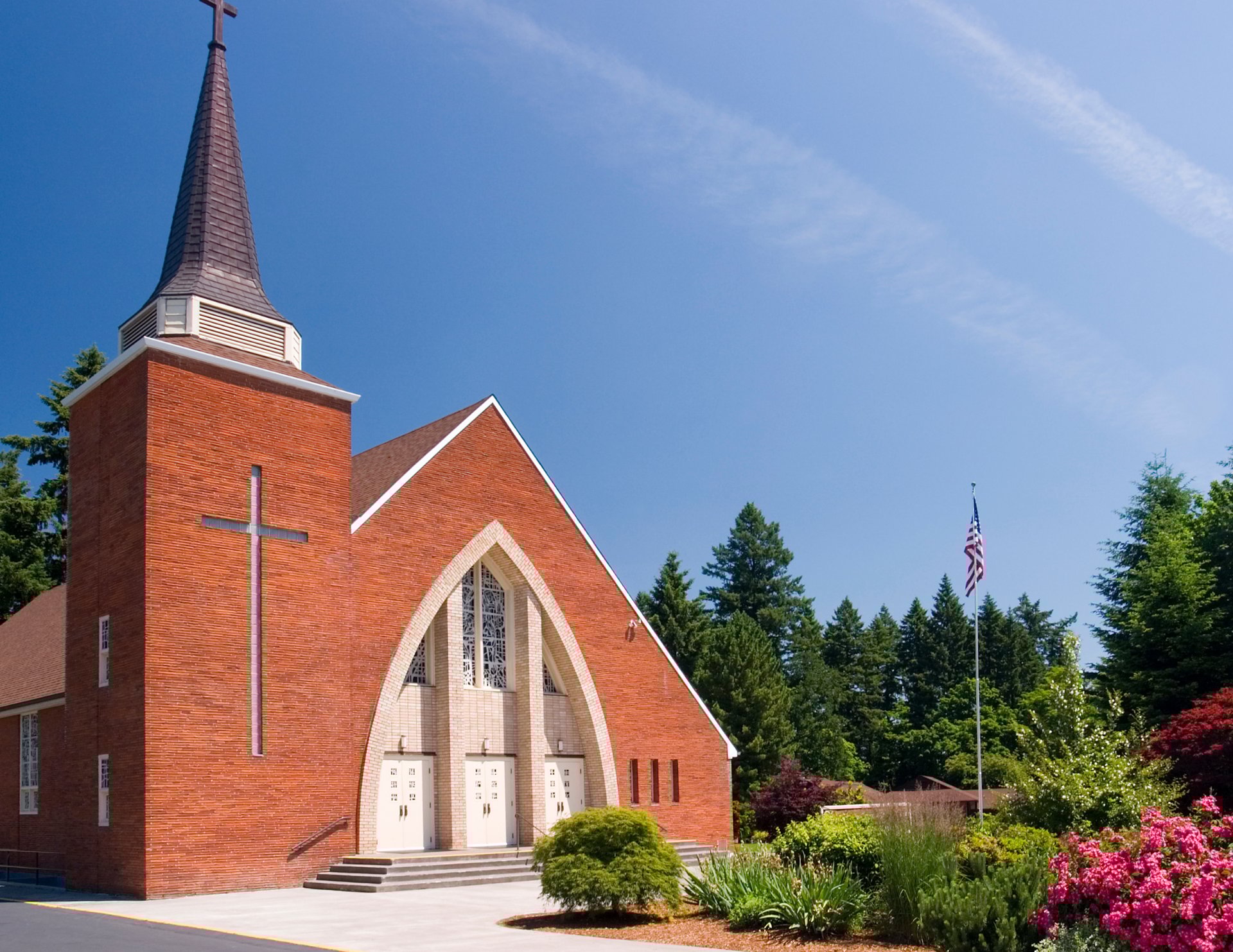a white church with a cross on top of it