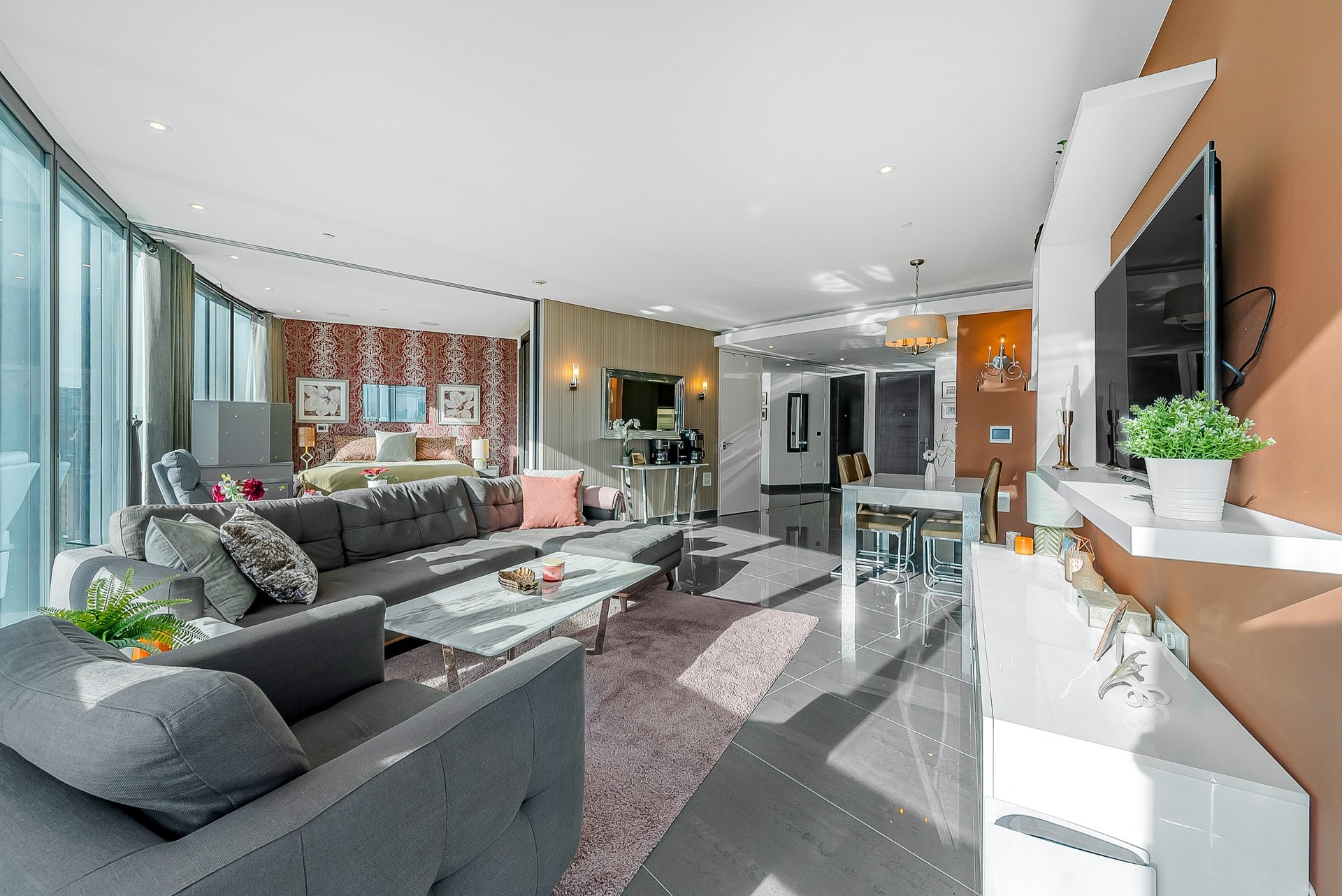 brown wooden bed frame with white cover beside brown wooden nightstand