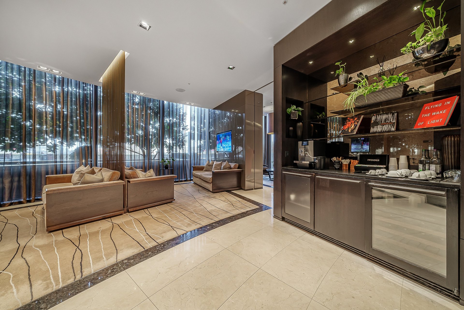 brown wooden bed frame with white cover beside brown wooden nightstand