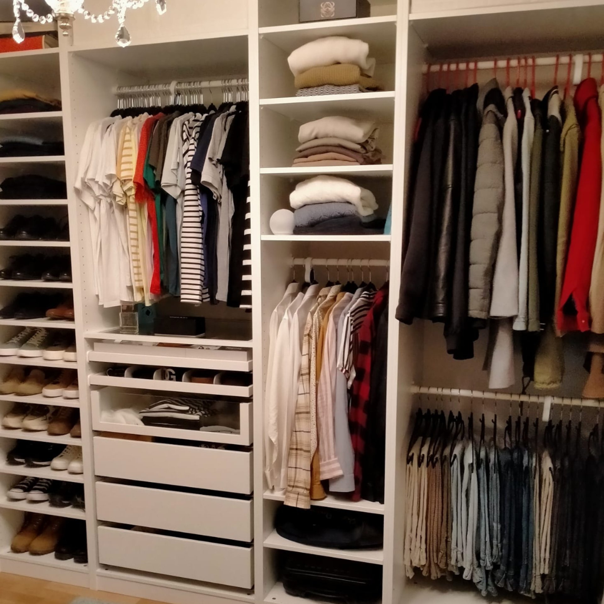 round brown wooden table with two brown ottomans