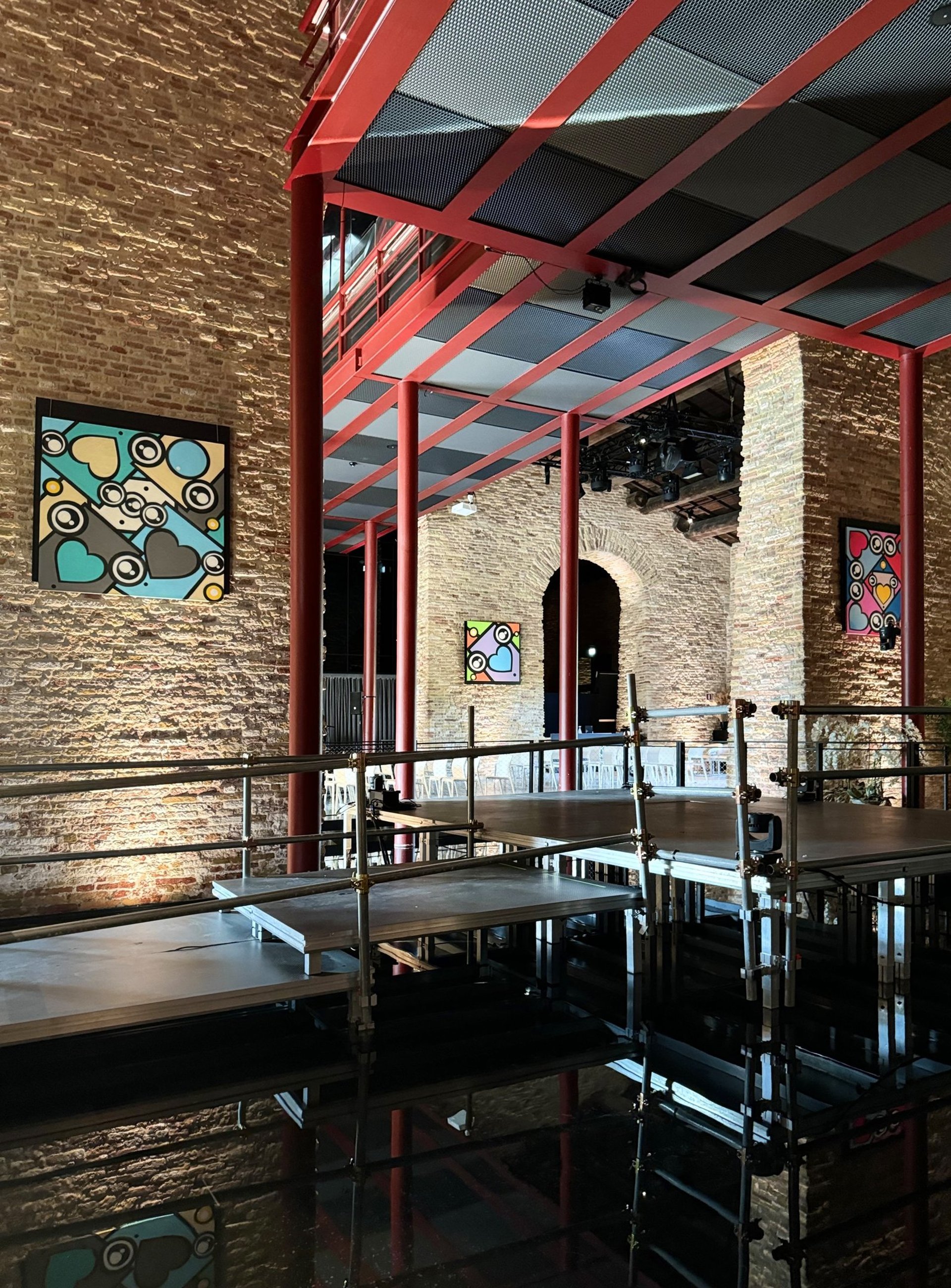 an abstract photo of a curved building with a blue sky in the background