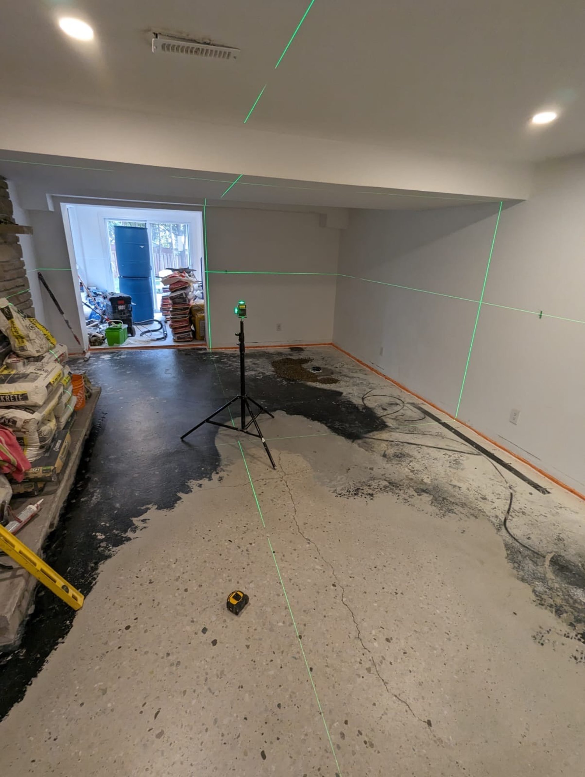 man in black sweatpants using DEWALT circular saw and cutting a wood plank