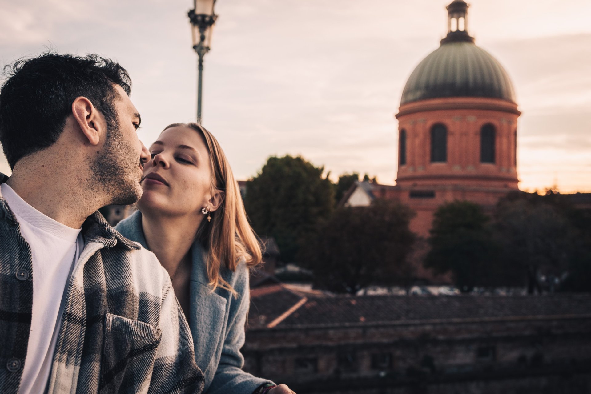 an abstract photo of a curved building with a blue sky in the background