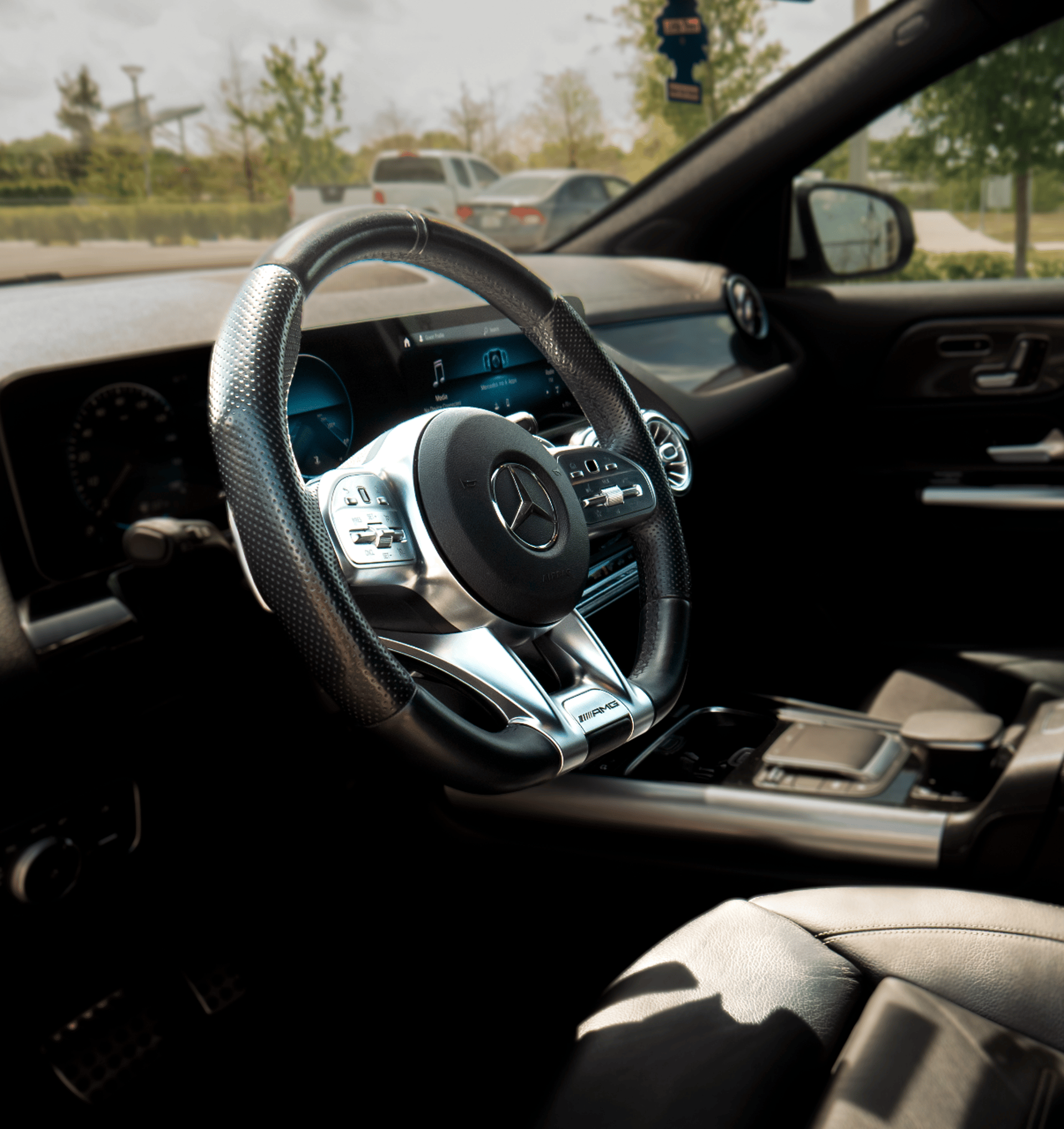 black and silver mercedes benz steering wheel