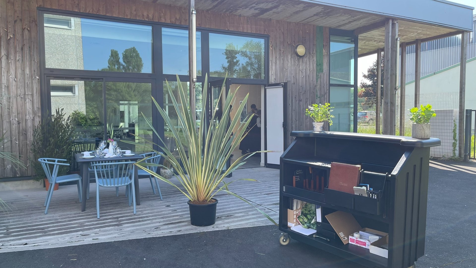 an abstract photo of a curved building with a blue sky in the background