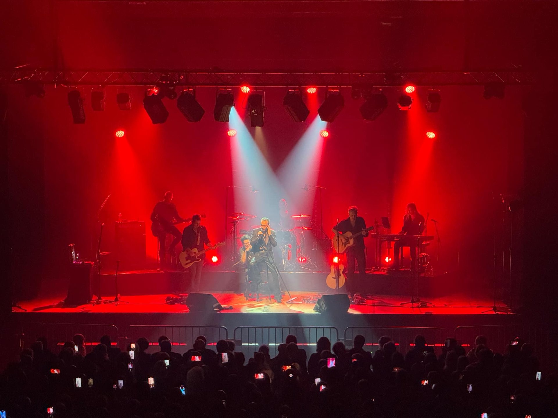 an abstract photo of a curved building with a blue sky in the background