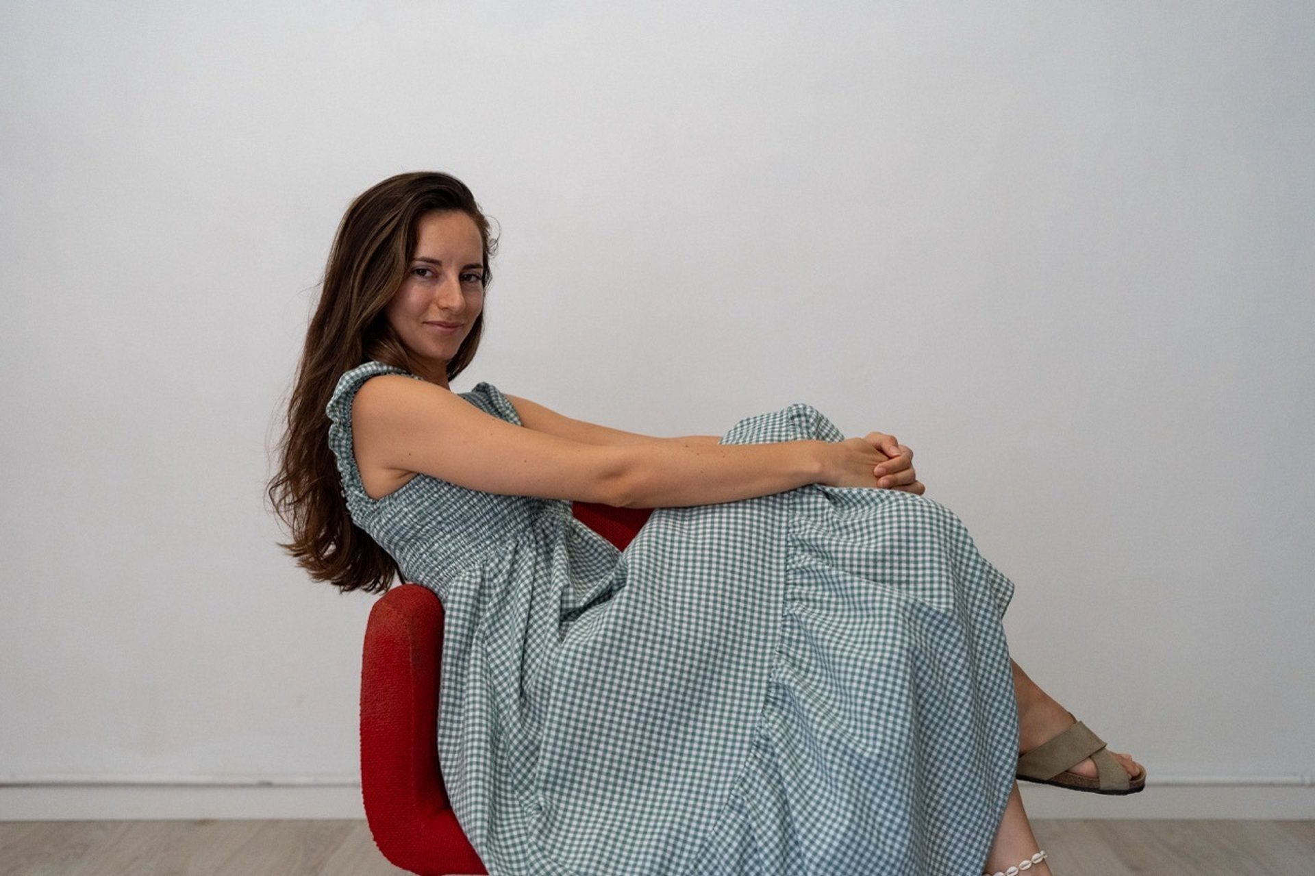 two women talking while looking at laptop computer