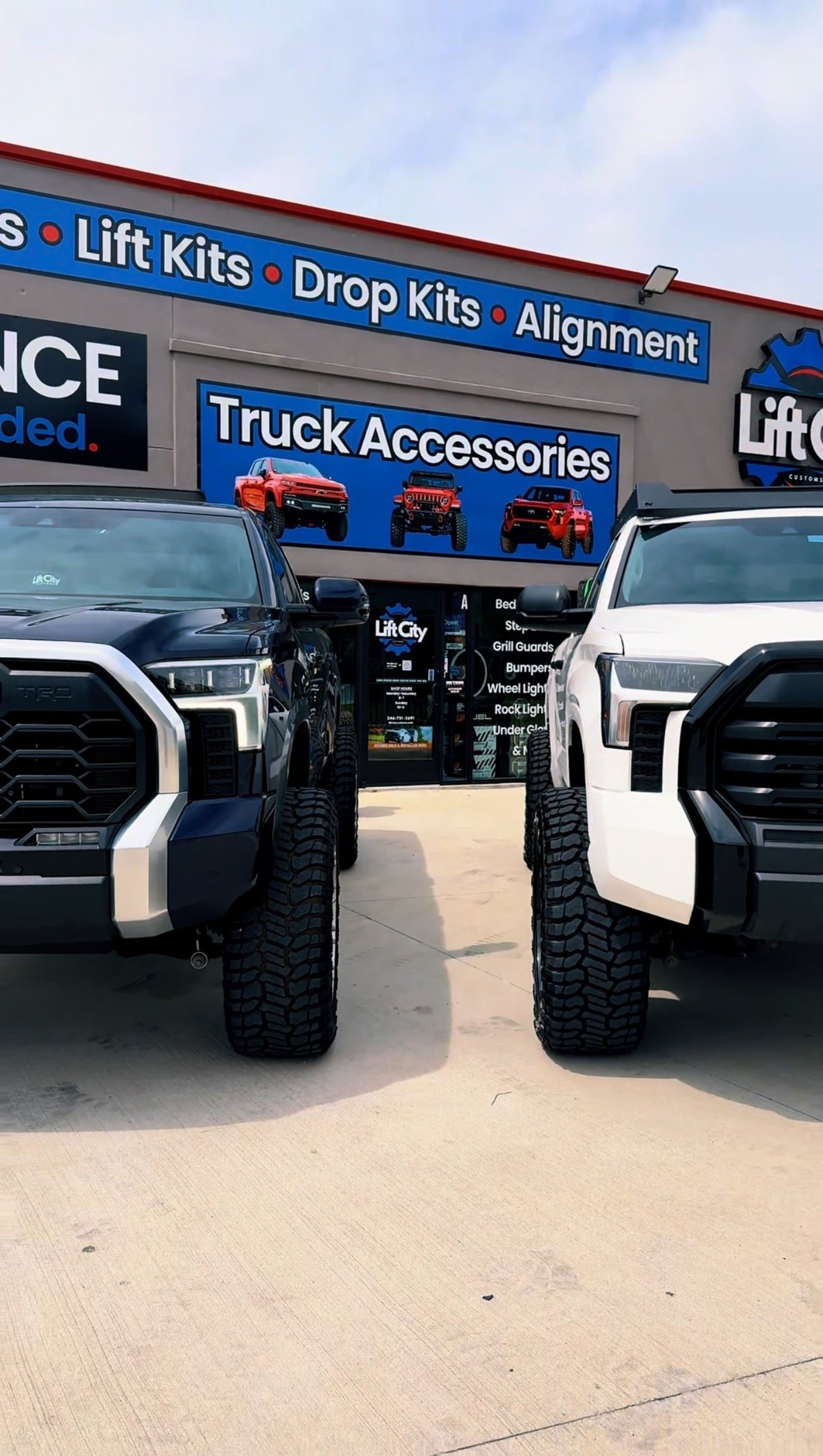 gray 4x4 vehicle climbing the rock during daytime