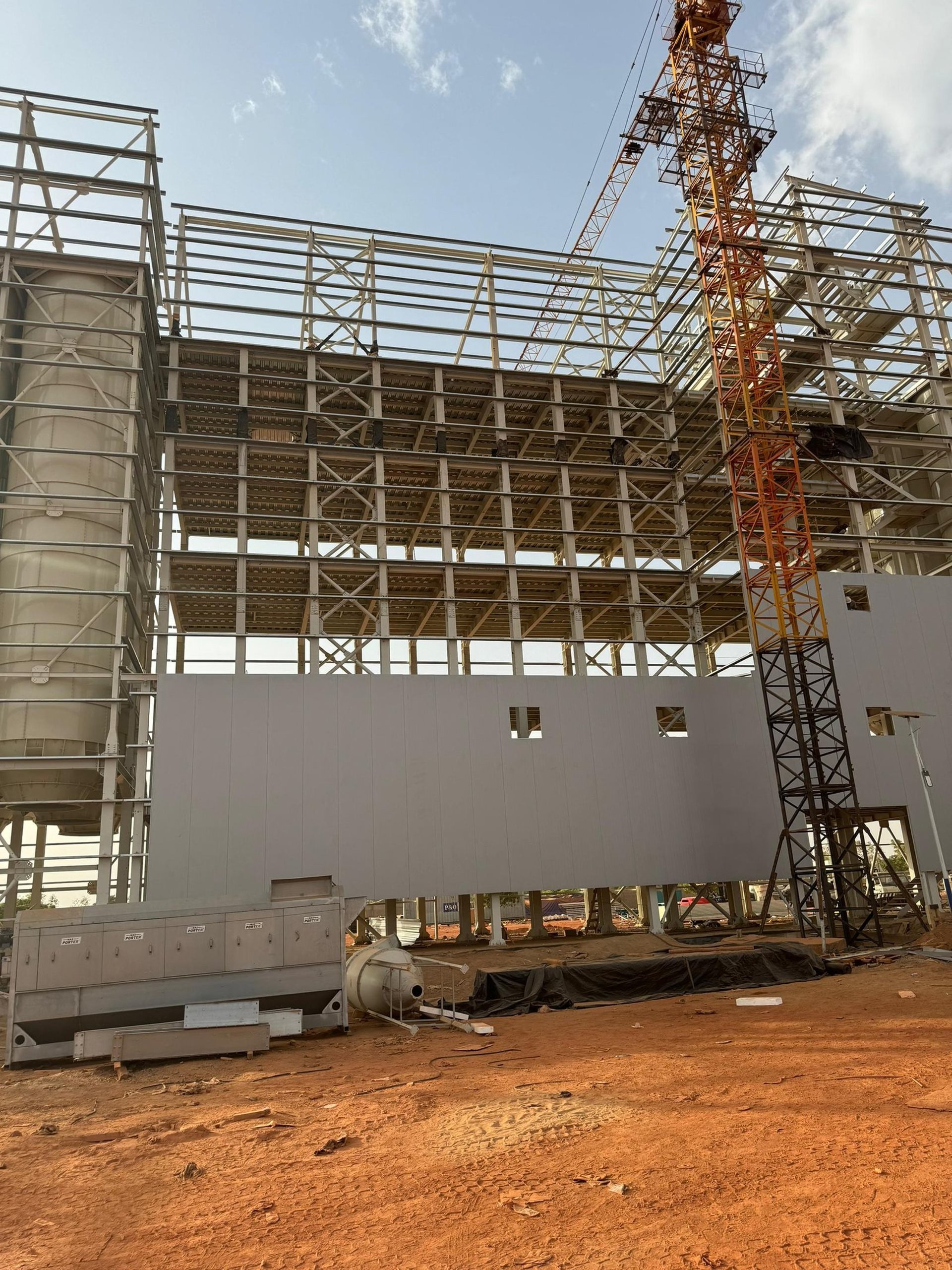 seven construction workers standing on white field