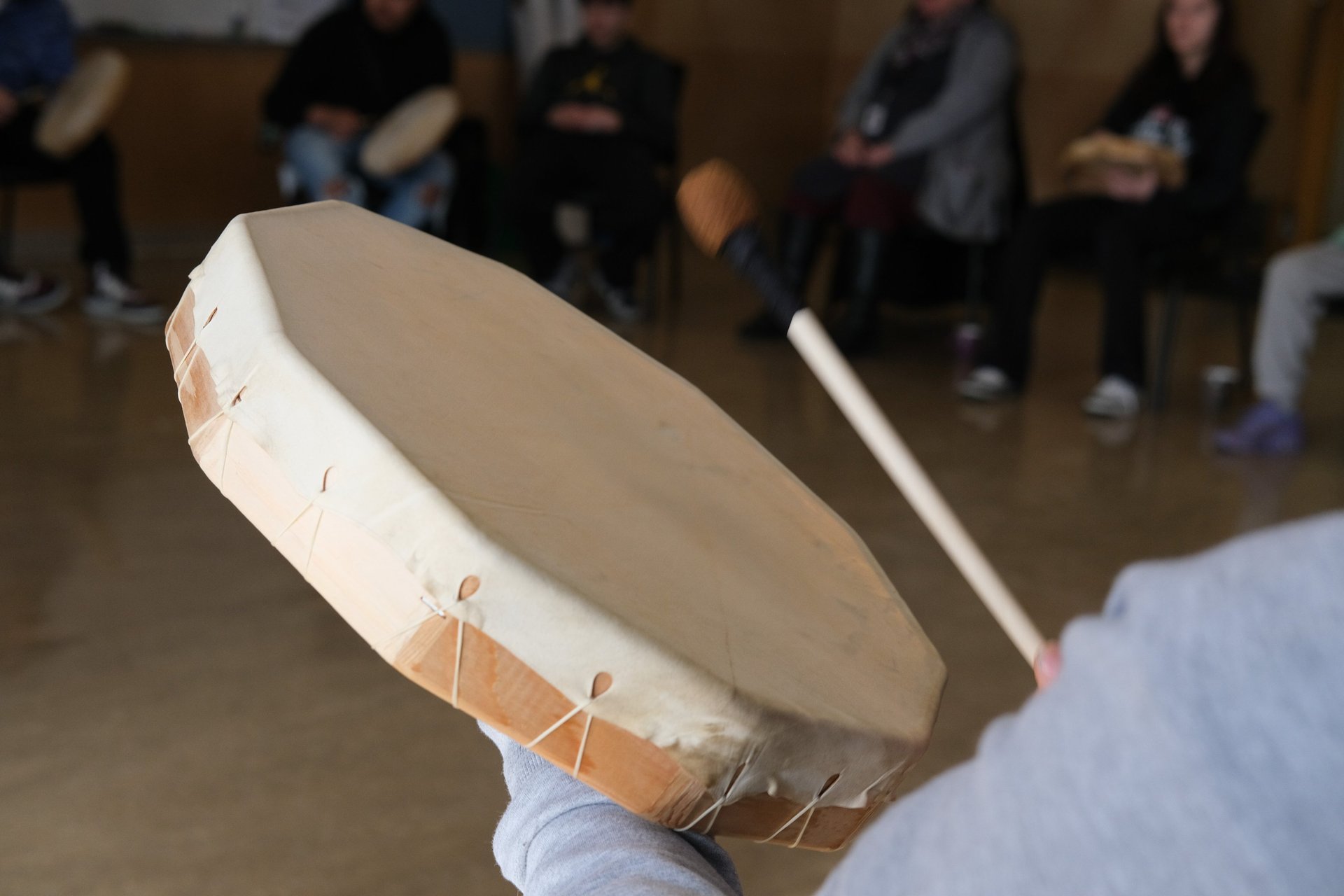 people sitting on grass field
