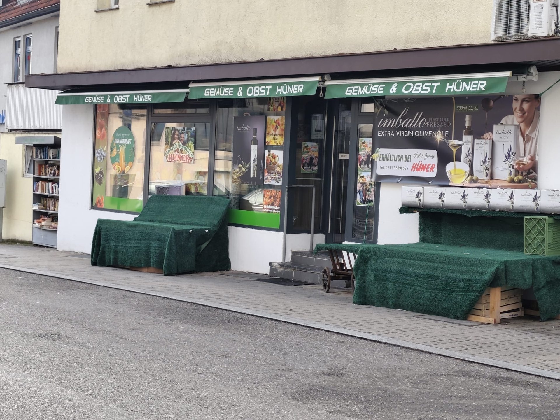 a bag of oranges and a pineapple on a table