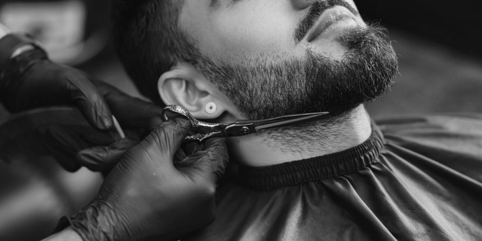 a person holding a pair of scissors in their hand