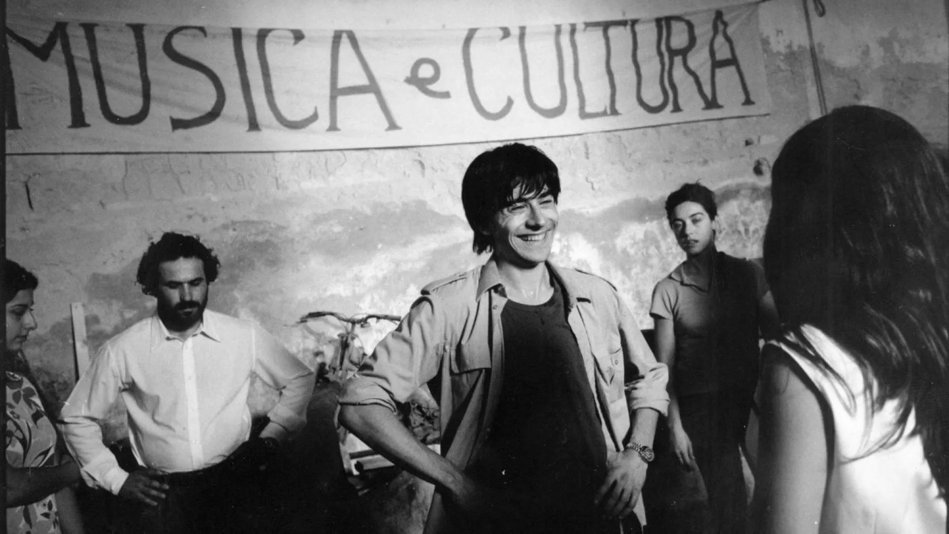 an abstract photo of a curved building with a blue sky in the background