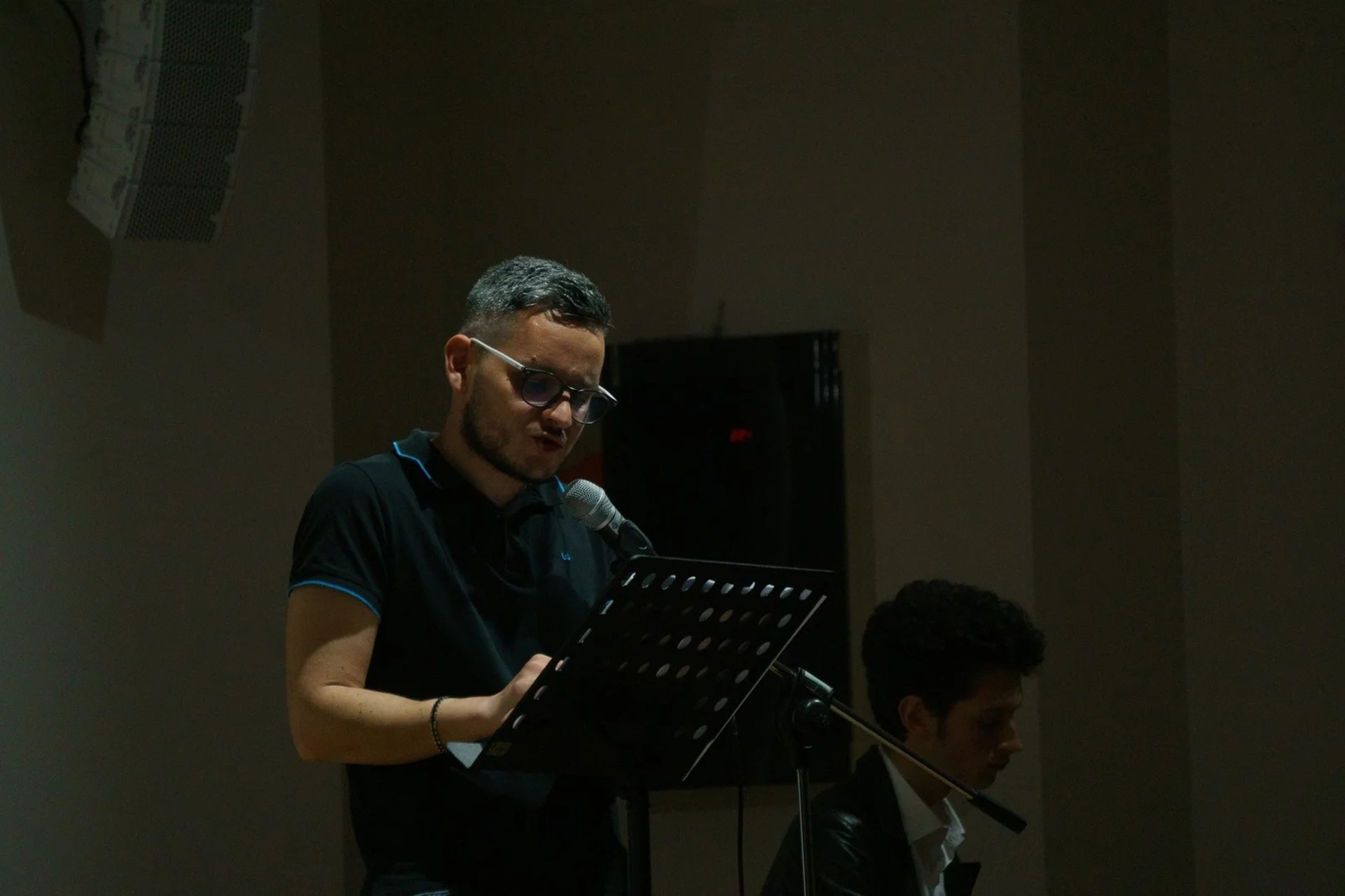 an abstract photo of a curved building with a blue sky in the background