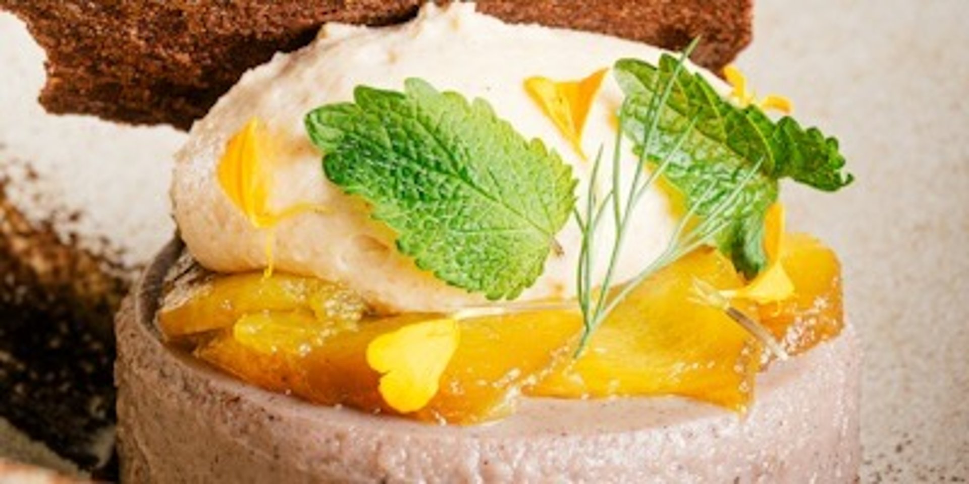 an abstract photo of a curved building with a blue sky in the background