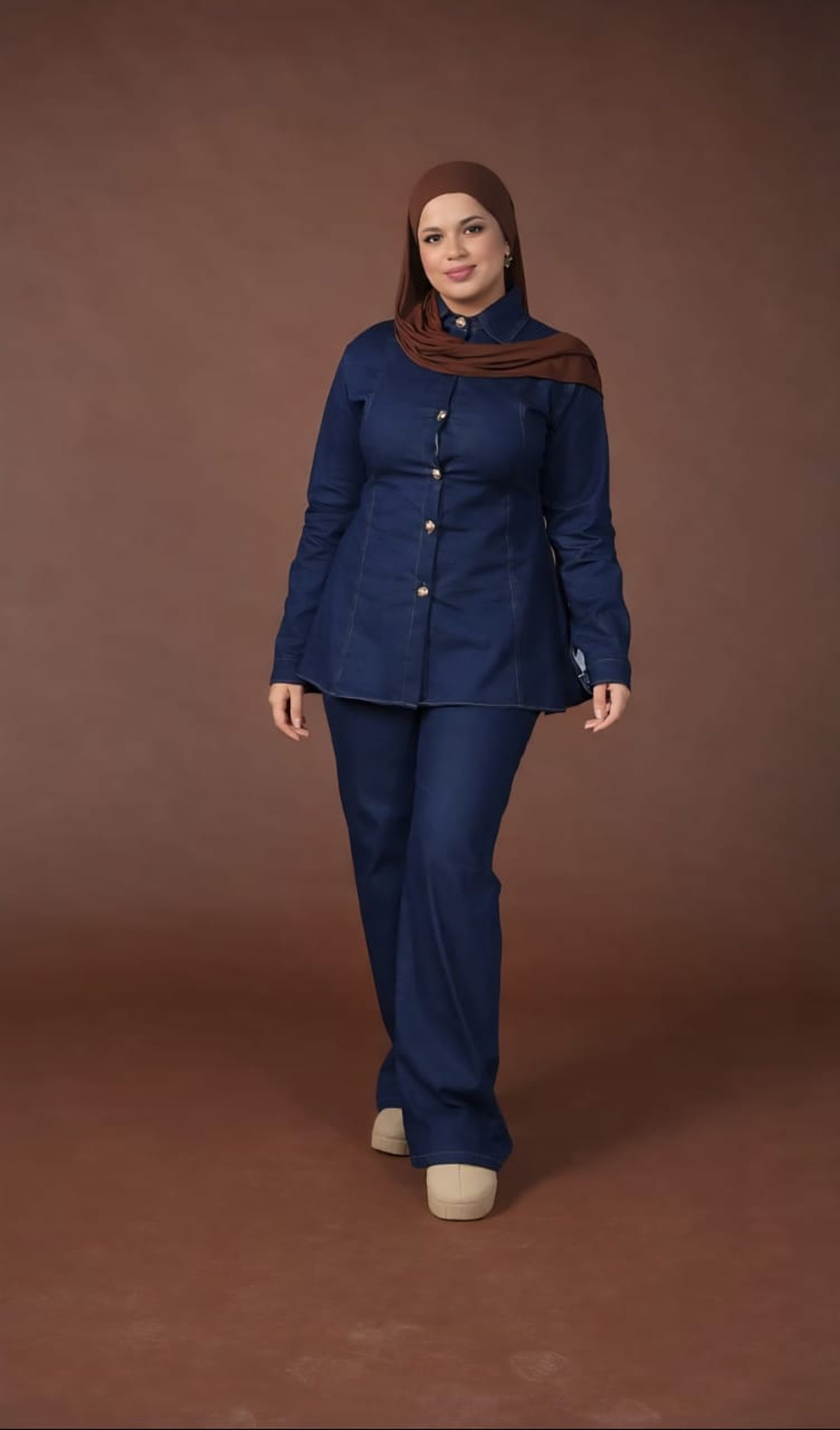 an abstract photo of a curved building with a blue sky in the background