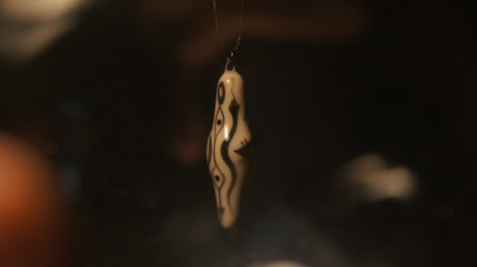 a close up of a black and brown abstract painting