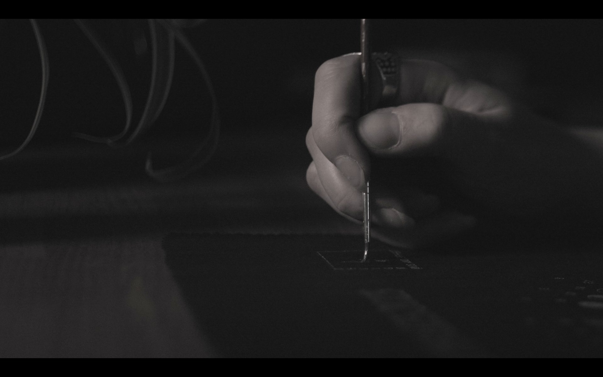 a close up of a black and brown abstract painting