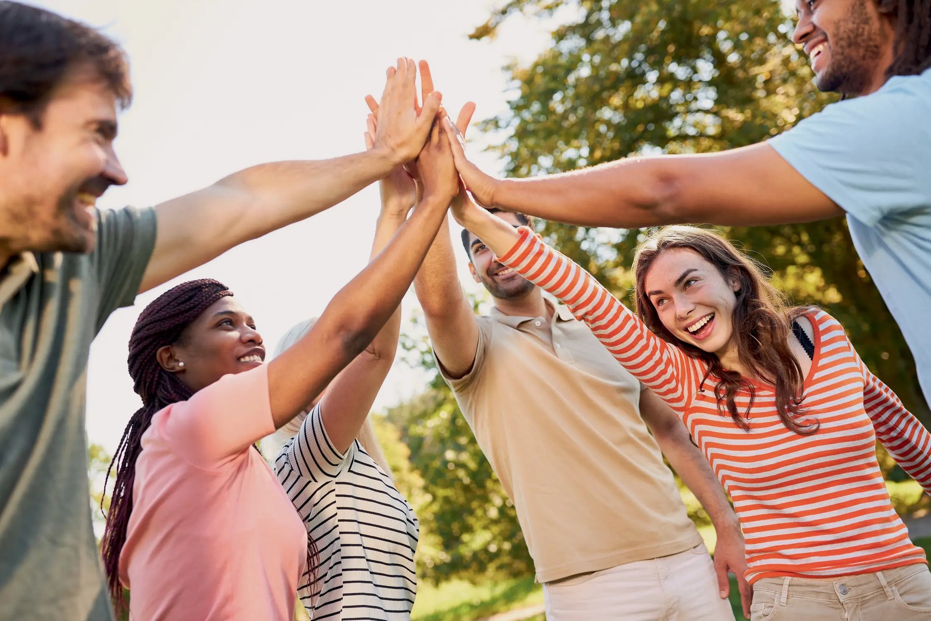 woman wearing yellow long-sleeved dress under white clouds and blue sky during daytime