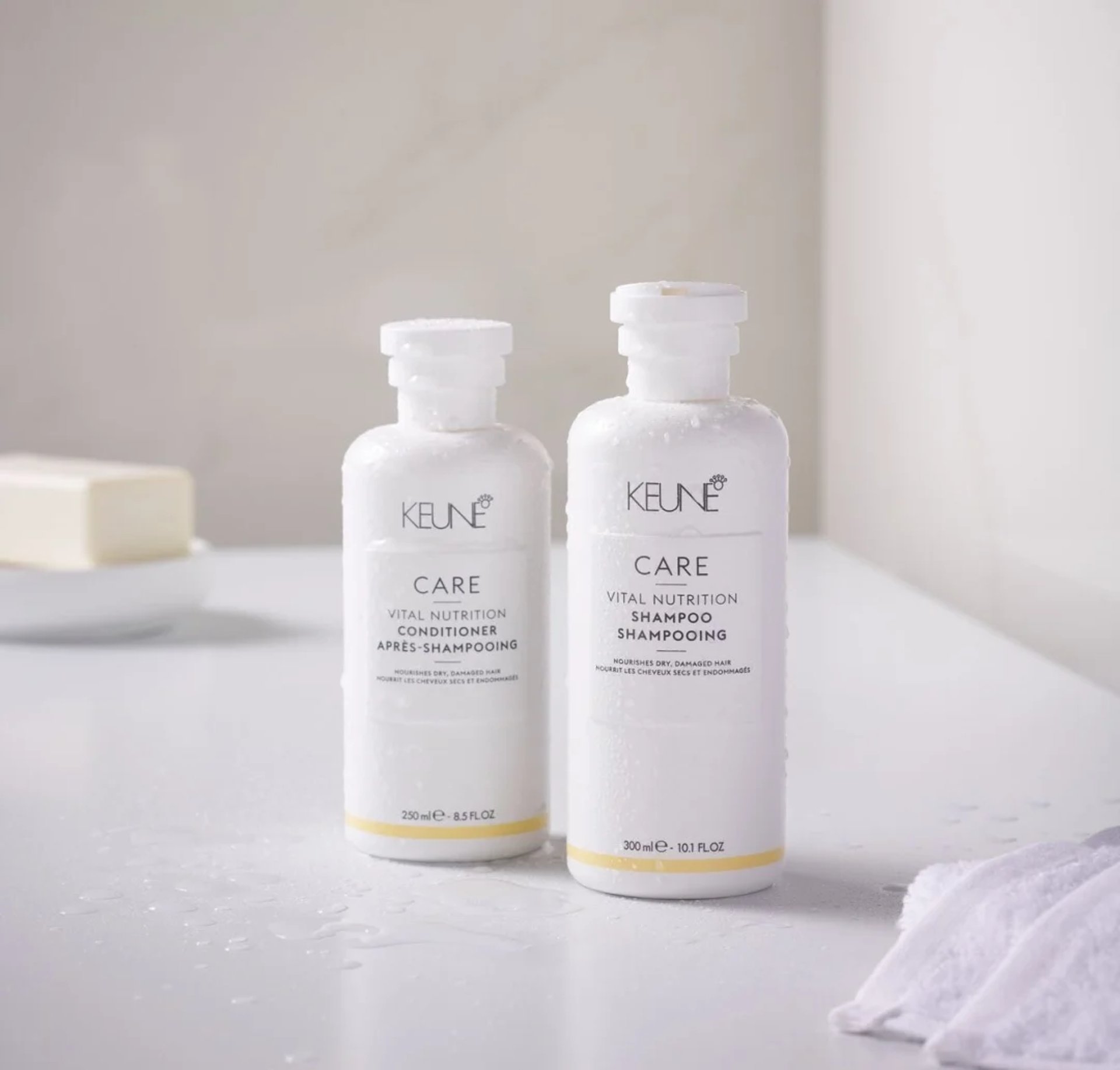 a bottle of keune care next to a container of hair care