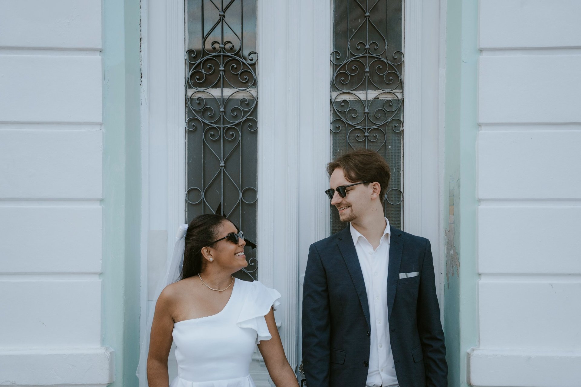 couple wearing silver-colored rings