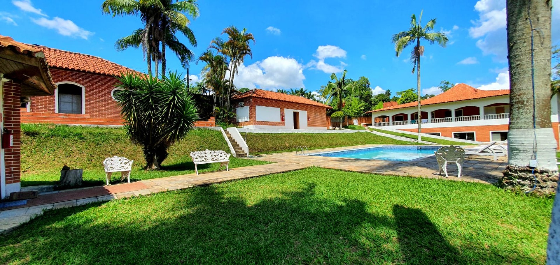 woman wearing yellow long-sleeved dress under white clouds and blue sky during daytime