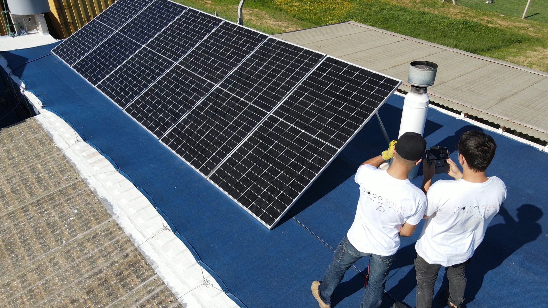 a white hard hat sitting on top of a solar panel