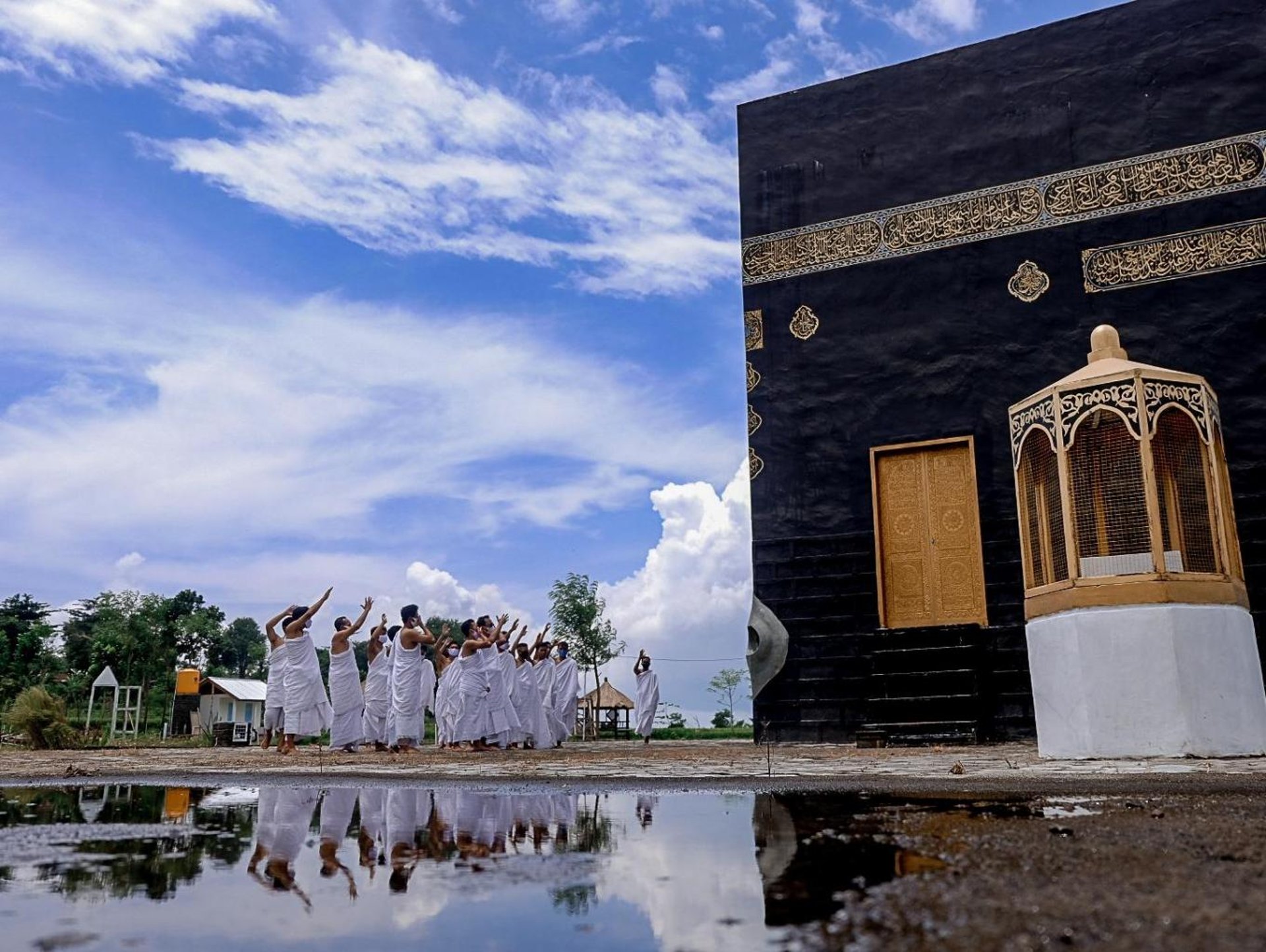 an abstract photo of a curved building with a blue sky in the background