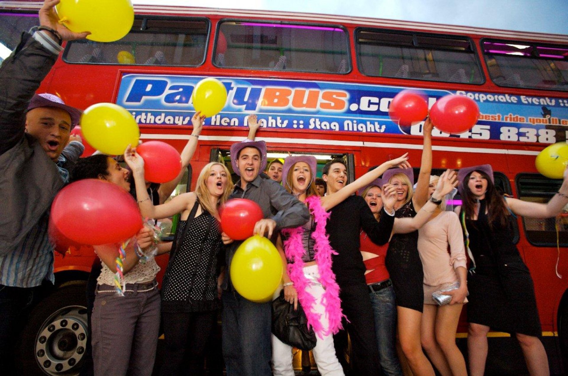woman wearing yellow long-sleeved dress under white clouds and blue sky during daytime