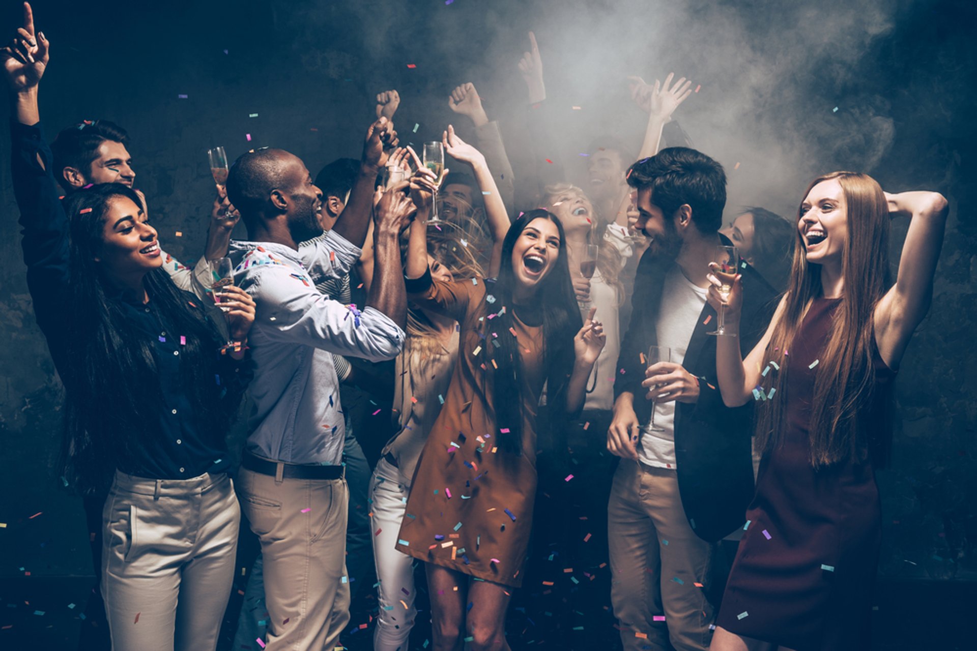 Friends celebrating on a Vegas party bus crawl with drinks and festive nightlife vibes.