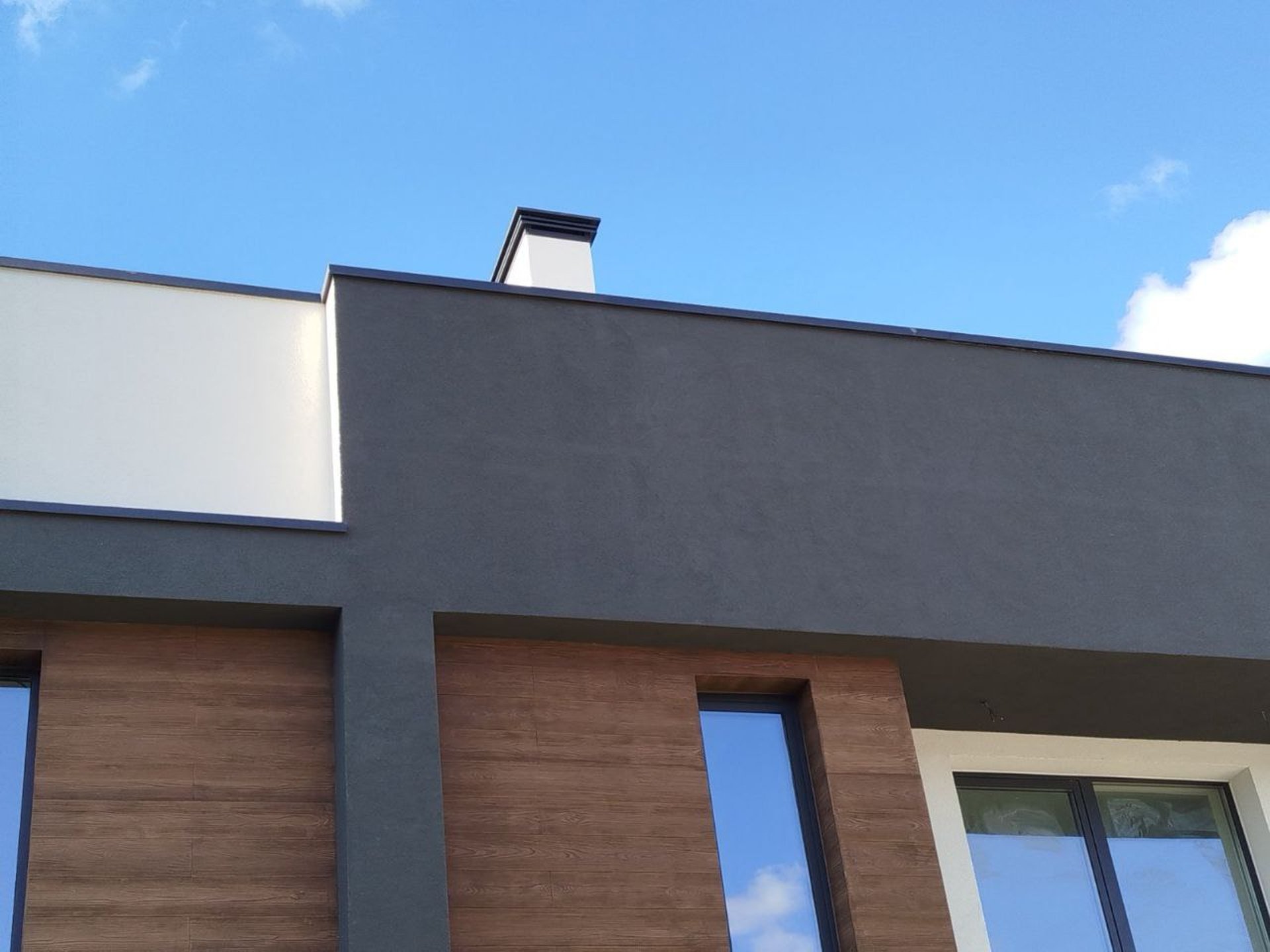 woman wearing yellow long-sleeved dress under white clouds and blue sky during daytime