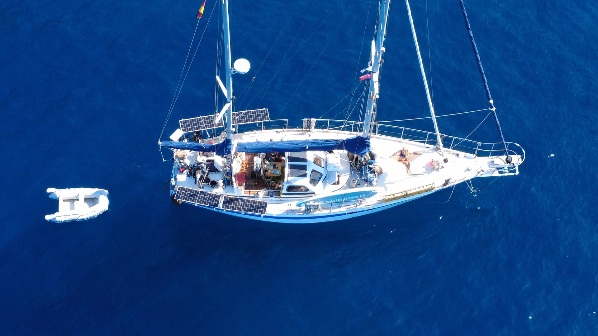 an abstract photo of a curved building with a blue sky in the background