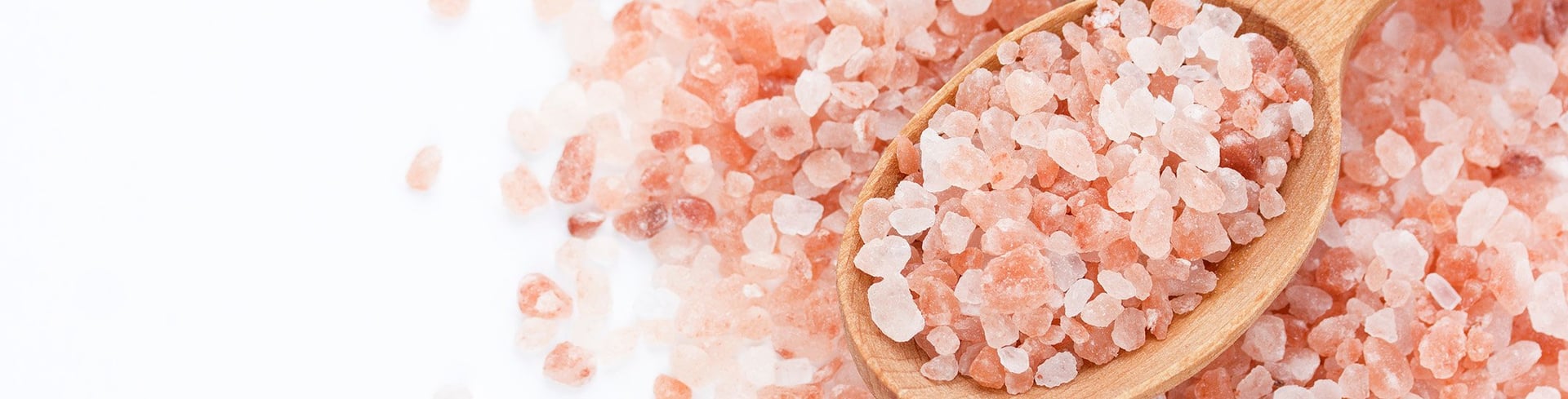 A pile of pink sugar cubes sitting on top of a table