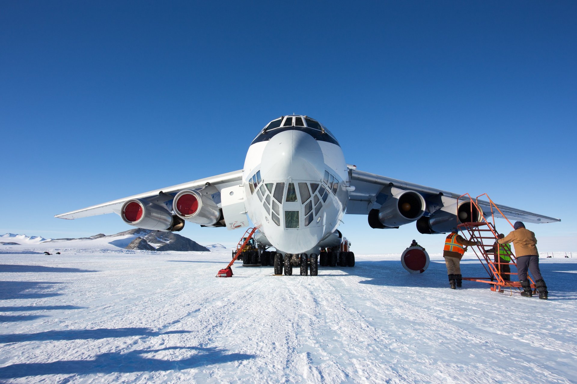 red and blue cargo ship on sea during daytime
