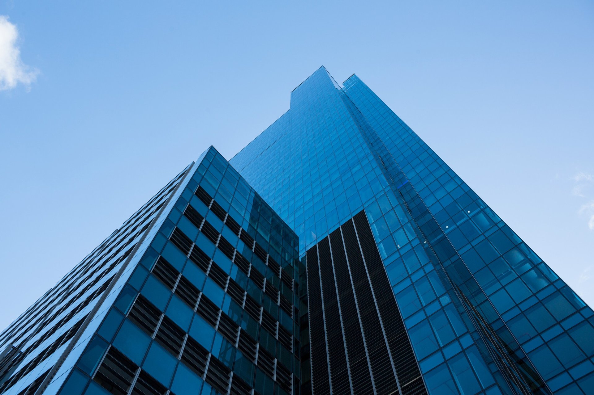 white and blue concrete building under blue sky during daytime