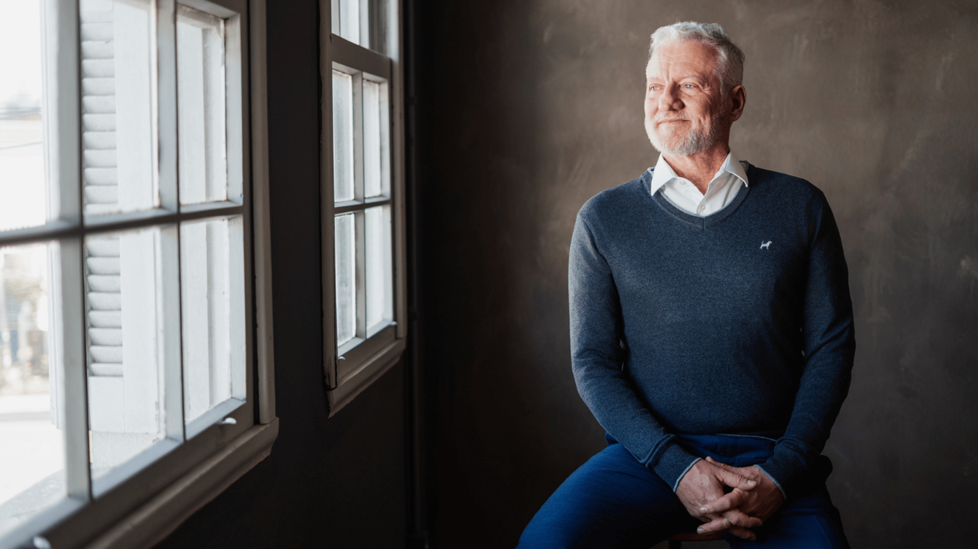 an abstract photo of a curved building with a blue sky in the background