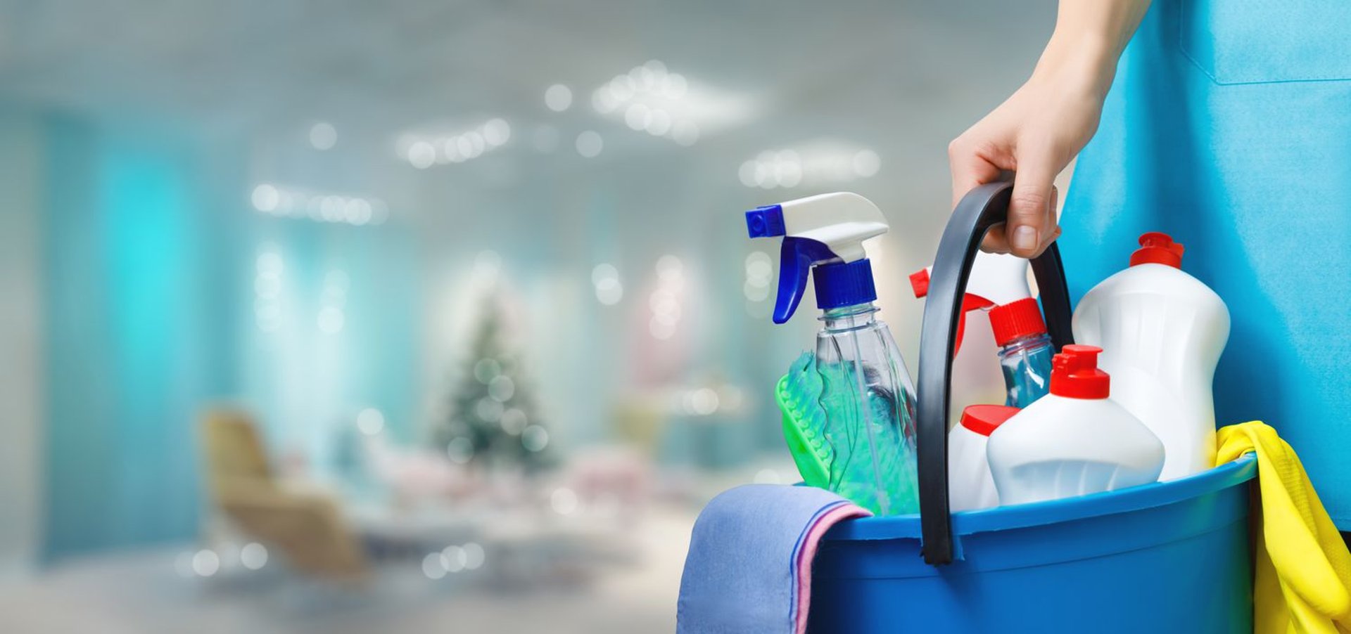 Woman with headphones mopping a wooden floor