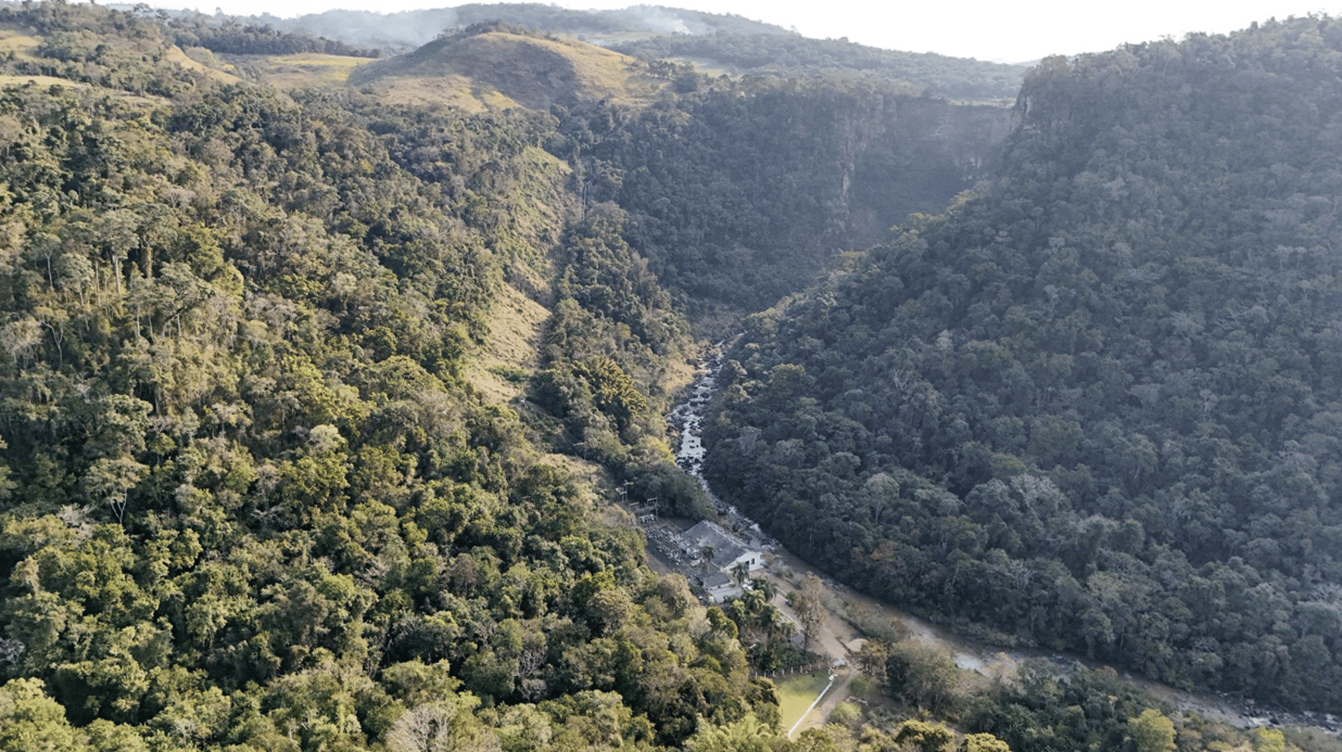 an abstract photo of a curved building with a blue sky in the background