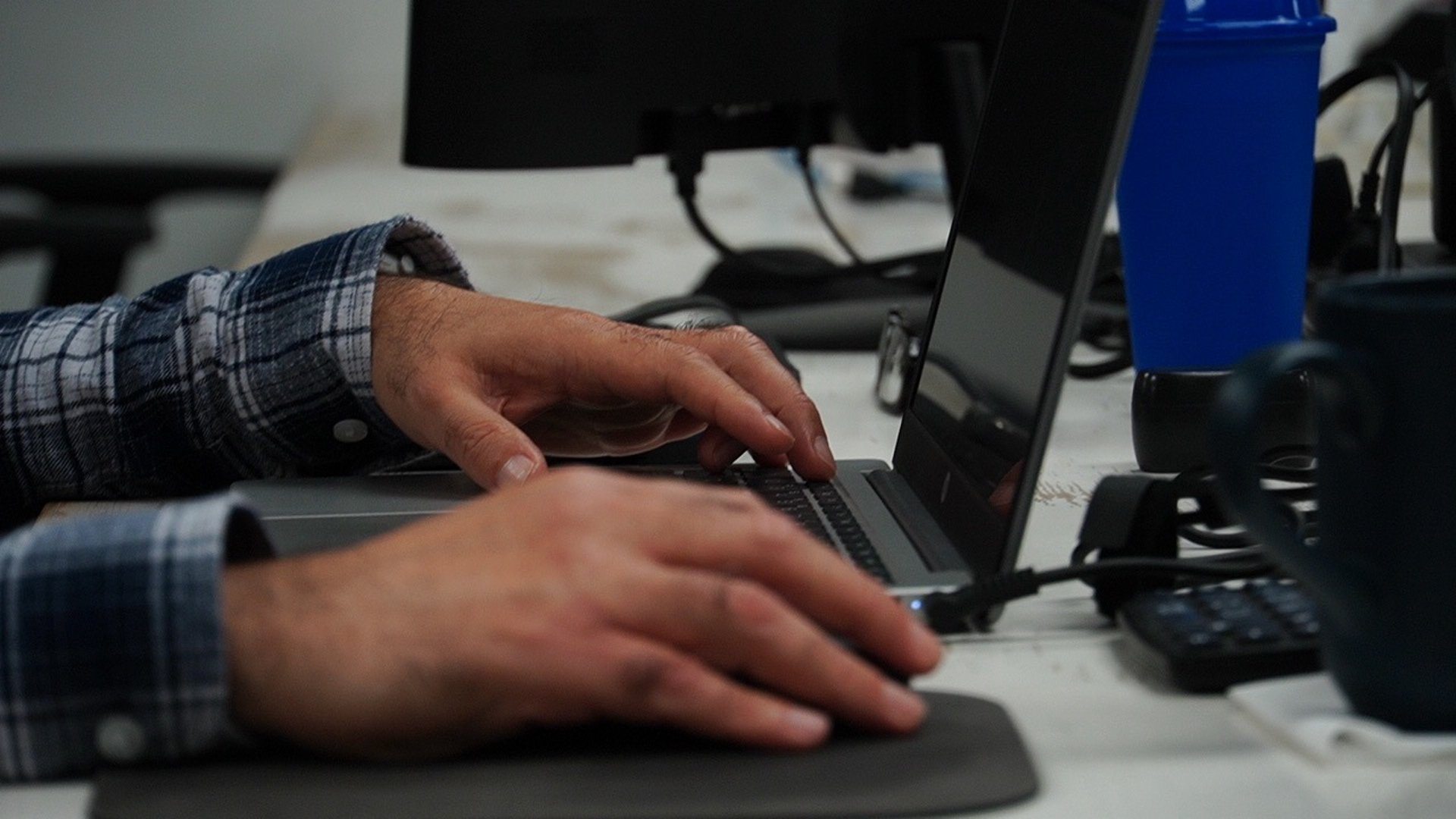 an abstract photo of a curved building with a blue sky in the background