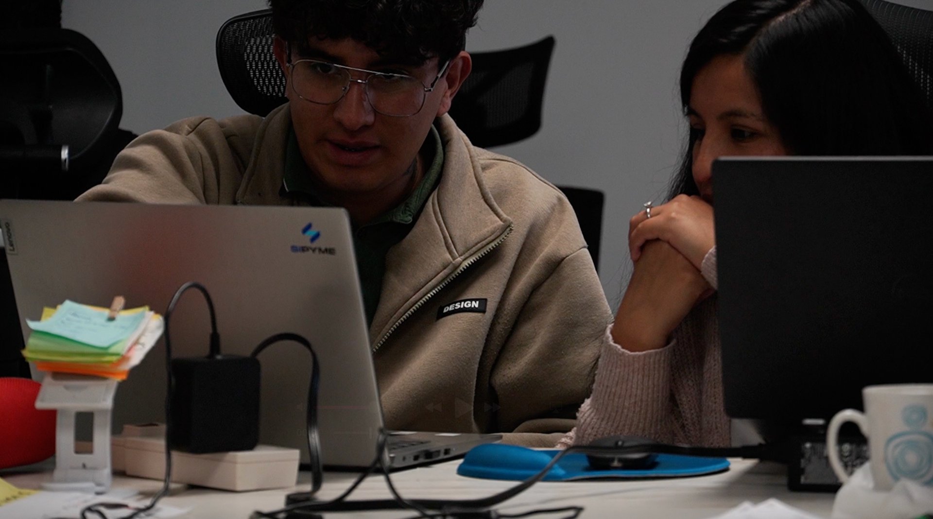 an abstract photo of a curved building with a blue sky in the background