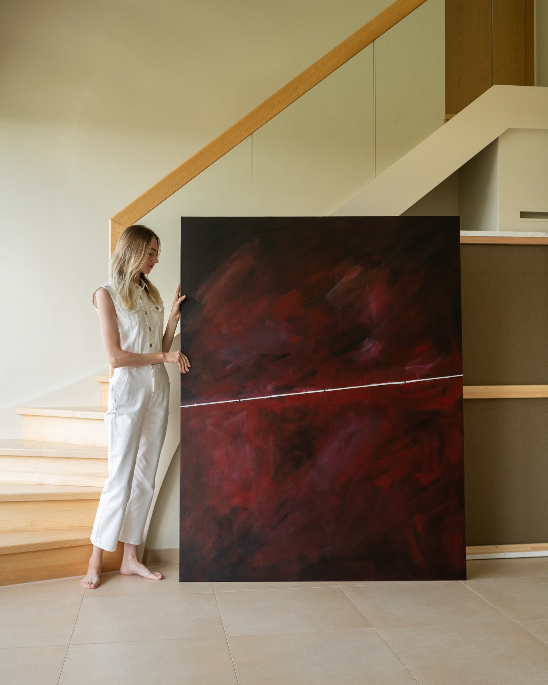 an abstract photo of a curved building with a blue sky in the background