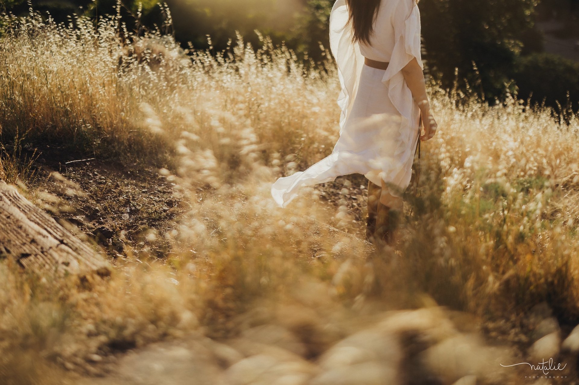 woman wearing yellow long-sleeved dress under white clouds and blue sky during daytime