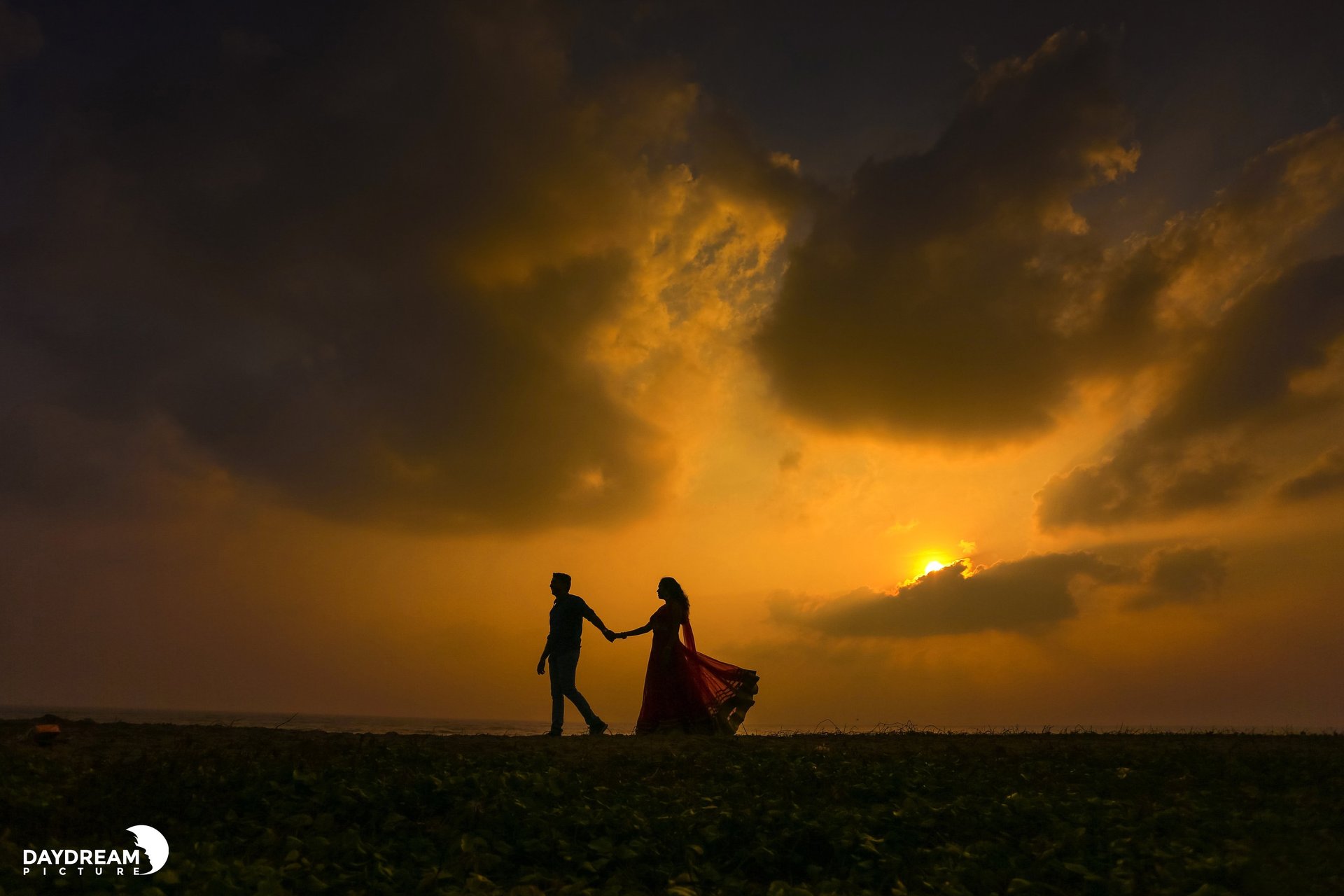 woman wearing yellow long-sleeved dress under white clouds and blue sky during daytime